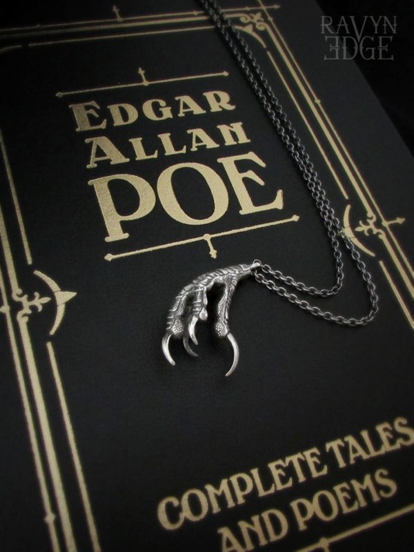 Small ravenclaw necklace on an Edgar Allan Poe book