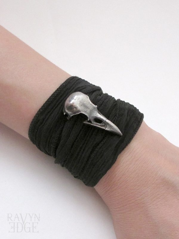 Medium sterling silver raven skull on silk wrap bracelet