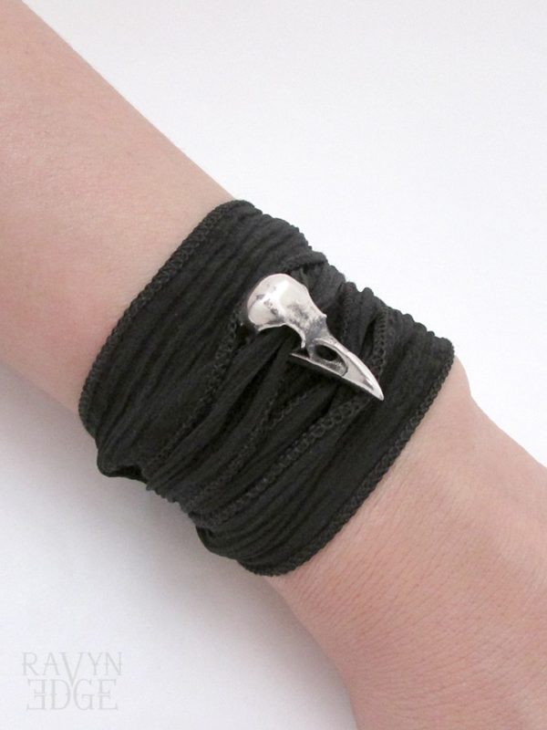 Small sterling silver raven skull and silk wrap bracelet