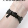 The tied ends of the mens and womens leather wrap bracelet, method one