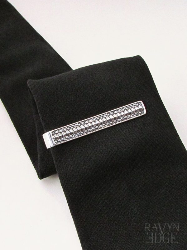 Sterling silver dragon scale tie bar on a black tie