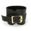 Brass buckle on a wide leather bracelet