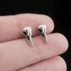 Edgy stud earrings shaped like crow skulls