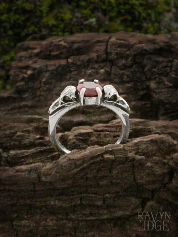 Raven skull promise ring with garnet birthstone