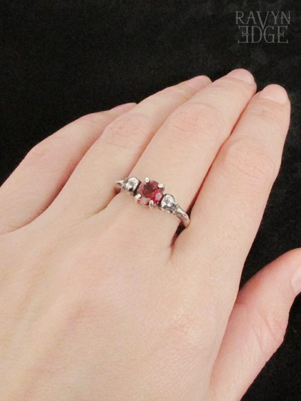 Garnet birthstone ring with dainty sterling silver raven skulls