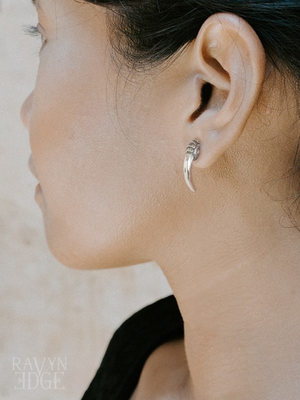 Woman wearing a sterling silver bird claw stud earring