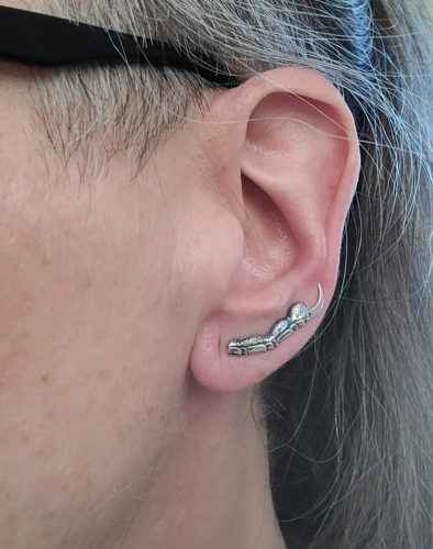 Raven claw sterling silver ear climber earrings on an ear