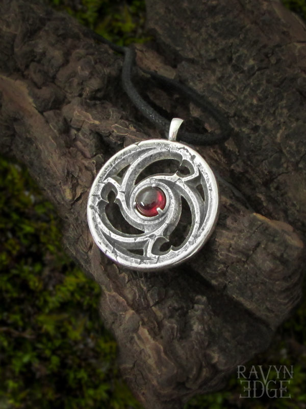 Sterling silver triskelion gothic window necklace with garnet