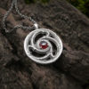 Garnet necklace with sterling silver triskelion spiral cathedral window design