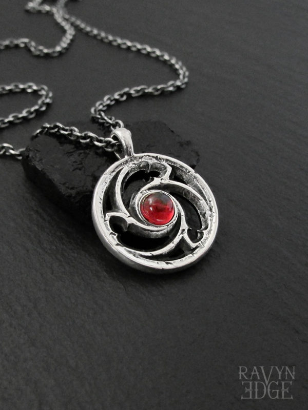 Sterling silver garnet necklace with triskele, january birthstone necklace