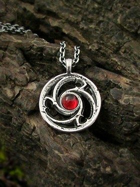 Gothic garnet necklace, triskelion cathedral window design in sterling silver